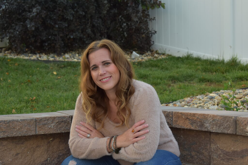 amber sitting next to a wall